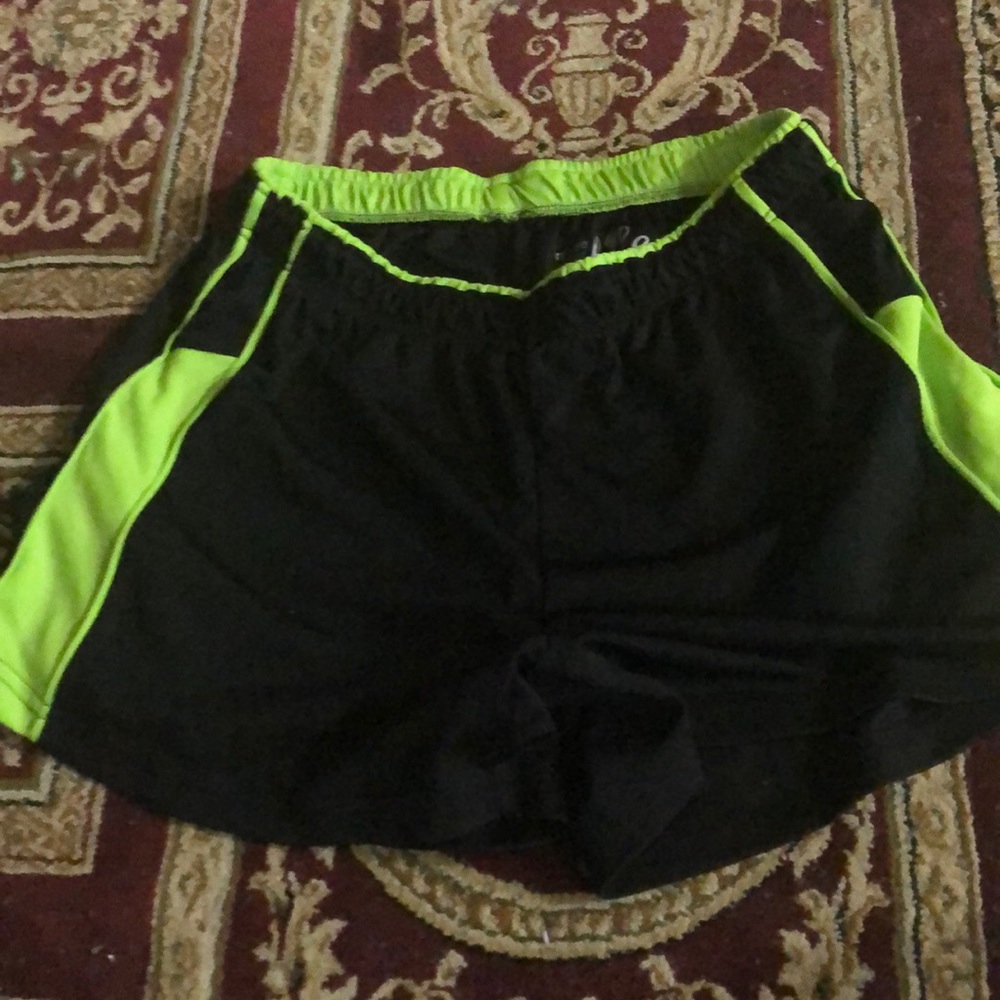 Green and black basketball shorts